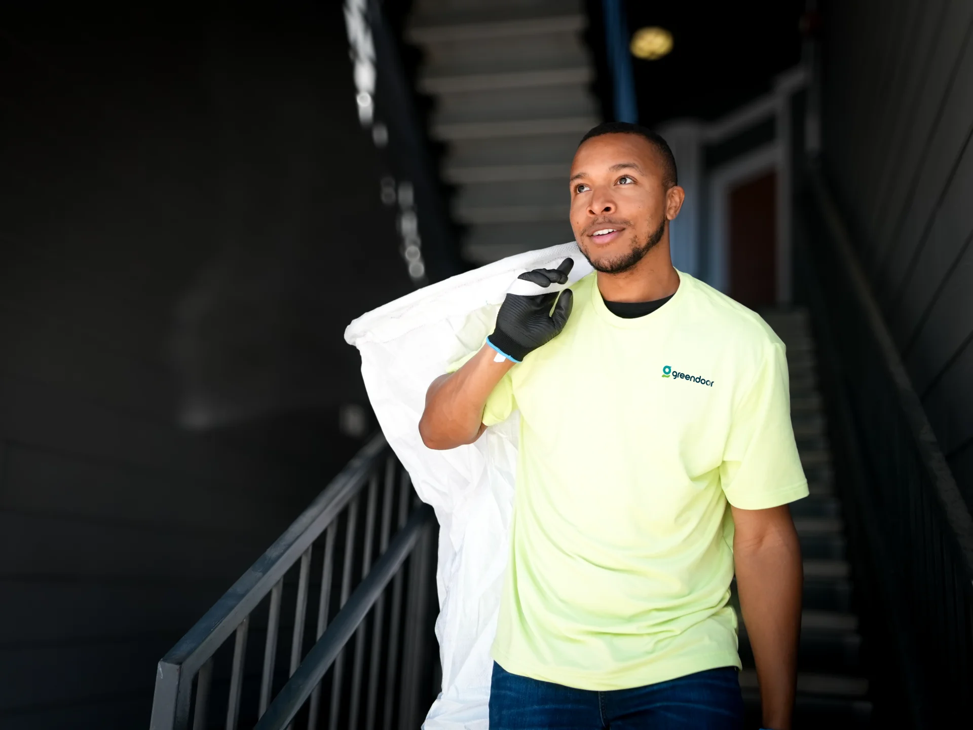 Green Door valet collecting trash